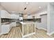 Modern kitchen with white cabinets, granite countertops, and a large island at 2318 E Brookside Ave, Indianapolis, IN 46218