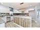 Modern kitchen with white cabinets, granite countertops, and a large island at 2318 E Brookside Ave, Indianapolis, IN 46218