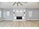 Bright living room featuring hardwood floors and a modern fireplace at 2318 E Brookside Ave, Indianapolis, IN 46218