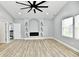 Spacious main bedroom with vaulted ceiling, hardwood floors and fireplace at 2318 E Brookside Ave, Indianapolis, IN 46218