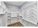 Spacious walk-in closet with ample shelving and hanging space at 2318 E Brookside Ave, Indianapolis, IN 46218