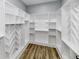 Large walk-in closet offers custom shelving and hanging rods at 2318 E Brookside Ave, Indianapolis, IN 46218
