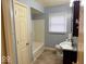 Clean bathroom with a tub, toilet and vanity at 3206 W 57Th St, Indianapolis, IN 46228