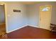 Small bedroom with wood flooring and exterior door at 3206 W 57Th St, Indianapolis, IN 46228