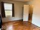 Bedroom with hardwood floors and access to bathroom at 3206 W 57Th St, Indianapolis, IN 46228