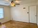 Bright bedroom with hardwood floors and ceiling fan at 3206 W 57Th St, Indianapolis, IN 46228