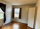 Well-lit bedroom with hardwood floors and a window at 3206 W 57Th St, Indianapolis, IN 46228