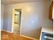 View from kitchen to living area with hardwood floors at 3206 W 57Th St, Indianapolis, IN 46228