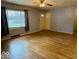 Hardwood floors and a cozy fireplace in this spacious living room at 3206 W 57Th St, Indianapolis, IN 46228