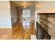 Hardwood floors and fireplace in this bright living room at 3206 W 57Th St, Indianapolis, IN 46228