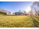 Serene backyard view of a log cabin home at 4298 W 300 N, Anderson, IN 46011