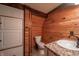 Bathroom with wood walls and a pedestal sink at 4298 W 300 N, Anderson, IN 46011