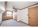 Cozy bedroom with wood-paneled wall and window at 4298 W 300 N, Anderson, IN 46011