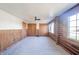 Charming bedroom showcasing log cabin walls and double closets at 4298 W 300 N, Anderson, IN 46011