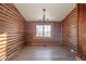 Rustic dining area with log walls and a chandelier at 4298 W 300 N, Anderson, IN 46011