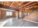 Open entryway with log cabin features and a view to dining room at 4298 W 300 N, Anderson, IN 46011