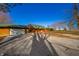 Log cabin home with attached garage and gravel driveway at 4298 W 300 N, Anderson, IN 46011