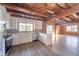 Open kitchen features exposed beams and island at 4298 W 300 N, Anderson, IN 46011