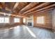 Large living room with stone fireplace and exposed beams at 4298 W 300 N, Anderson, IN 46011