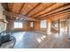 Bright living room with log cabin features and wood floors at 4298 W 300 N, Anderson, IN 46011
