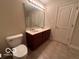 Bathroom with double vanity and large mirror at 581 Beehler Dr, Whiteland, IN 46184