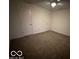 Spacious bedroom with two entry doors and carpeting at 581 Beehler Dr, Whiteland, IN 46184
