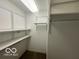 Spacious walk-in closet with built-in shelving and hanging rods at 581 Beehler Dr, Whiteland, IN 46184