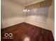 Dining room with hardwood floors and a window with blinds at 581 Beehler Dr, Whiteland, IN 46184