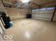 Spacious garage with overhead storage and epoxy floor at 581 Beehler Dr, Whiteland, IN 46184