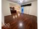 Open living room with hardwood floors and access to the kitchen at 581 Beehler Dr, Whiteland, IN 46184