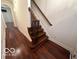 Elegant staircase with wrought iron balusters and hardwood treads at 581 Beehler Dr, Whiteland, IN 46184