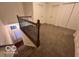 Upstairs hallway with carpet and wrought iron railing at 581 Beehler Dr, Whiteland, IN 46184