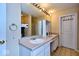 Double vanity bathroom with large mirror at 8231 Golden Ridge Ln, Indianapolis, IN 46237