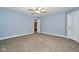 Spacious bedroom with neutral walls and carpet at 8231 Golden Ridge Ln, Indianapolis, IN 46237
