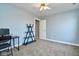 Bedroom with a desk, shelving unit, and light blue walls at 8231 Golden Ridge Ln, Indianapolis, IN 46237