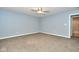 Spacious bedroom with neutral walls and carpet at 8231 Golden Ridge Ln, Indianapolis, IN 46237