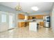 Spacious kitchen with an island, stainless steel appliances, and light wood cabinets at 8231 Golden Ridge Ln, Indianapolis, IN 46237