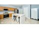 Spacious kitchen with an island, stainless steel appliances, and light wood cabinets at 8231 Golden Ridge Ln, Indianapolis, IN 46237
