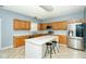 Spacious kitchen with an island, stainless steel appliances, and light wood cabinets at 8231 Golden Ridge Ln, Indianapolis, IN 46237