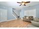 Living room with hardwood floors, and stairs to the second floor at 8231 Golden Ridge Ln, Indianapolis, IN 46237