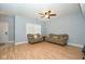 Bright living room with hardwood floors and comfy seating at 8231 Golden Ridge Ln, Indianapolis, IN 46237