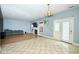 Living room with fireplace, hardwood floors, and large windows at 8231 Golden Ridge Ln, Indianapolis, IN 46237