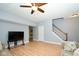 Spacious living area with hardwood floors and staircase at 8231 Golden Ridge Ln, Indianapolis, IN 46237