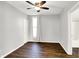 Charming bedroom with hardwood floors, ceiling fan, and large window at 109 N Grant St, Lebanon, IN 46052