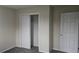 Bedroom with sliding door closet and grey carpet at 1320 Smokey Rd, Martinsville, IN 46151