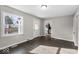 Bright living room with gray vinyl flooring and an open floor plan at 1504 W 11Th St, Anderson, IN 46016