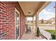 Covered front porch with rocking chairs, offering curb appeal at 165 Warrington Dr, Pittsboro, IN 46167