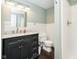 Updated bathroom with dark vanity, marble countertop, and shower at 1850 White Oak W Ln, Martinsville, IN 46151