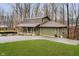 Green house with brown roof, attached garage, and grassy yard at 1850 White Oak W Ln, Martinsville, IN 46151