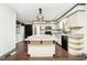 Kitchen with island, stainless steel appliances, and hardwood floors at 1850 White Oak W Ln, Martinsville, IN 46151